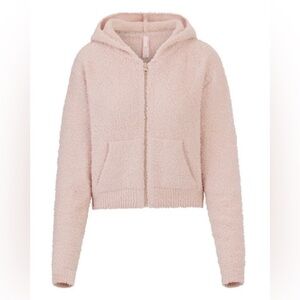 SKIMS pink zip-up